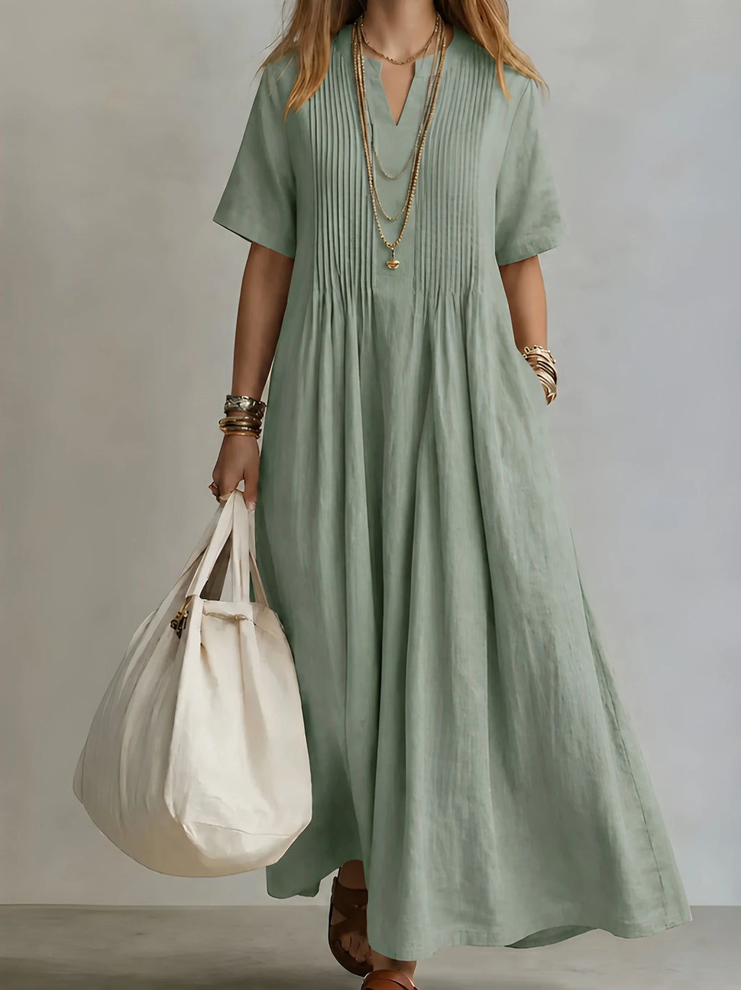 Women's Elegant Maxi Dress with Pleated Front and Pockets